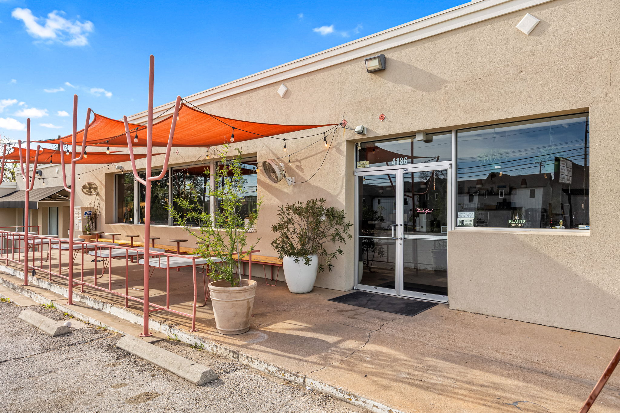 4805 Louis Avenue Austin, TX 78721 - Photo 21 of 23 a view of a patio with table and chairs potted plants