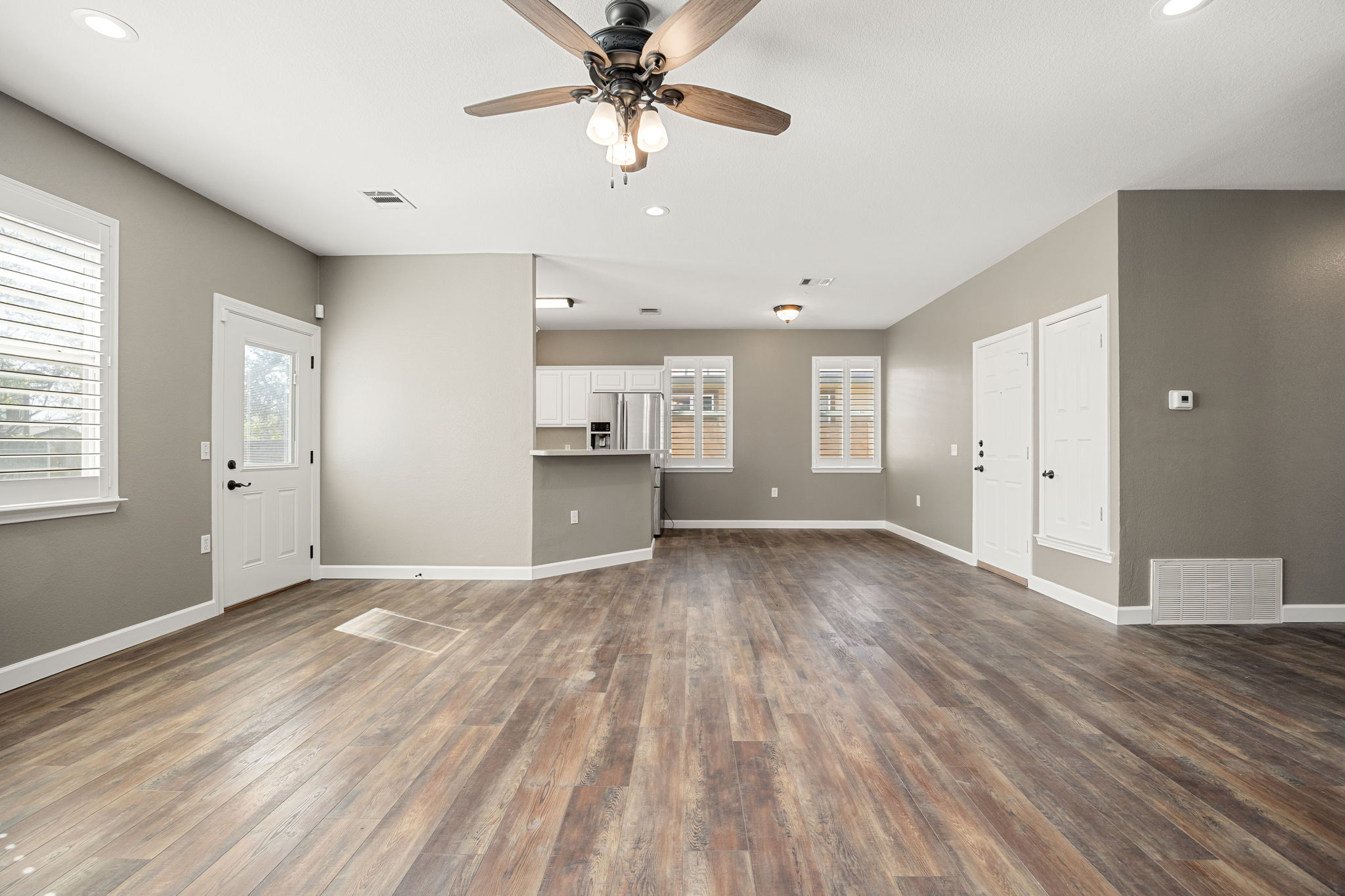 4805 Louis Avenue Austin, TX 78721 - Photo 3 of 23 a view of empty room with wooden floor and fan