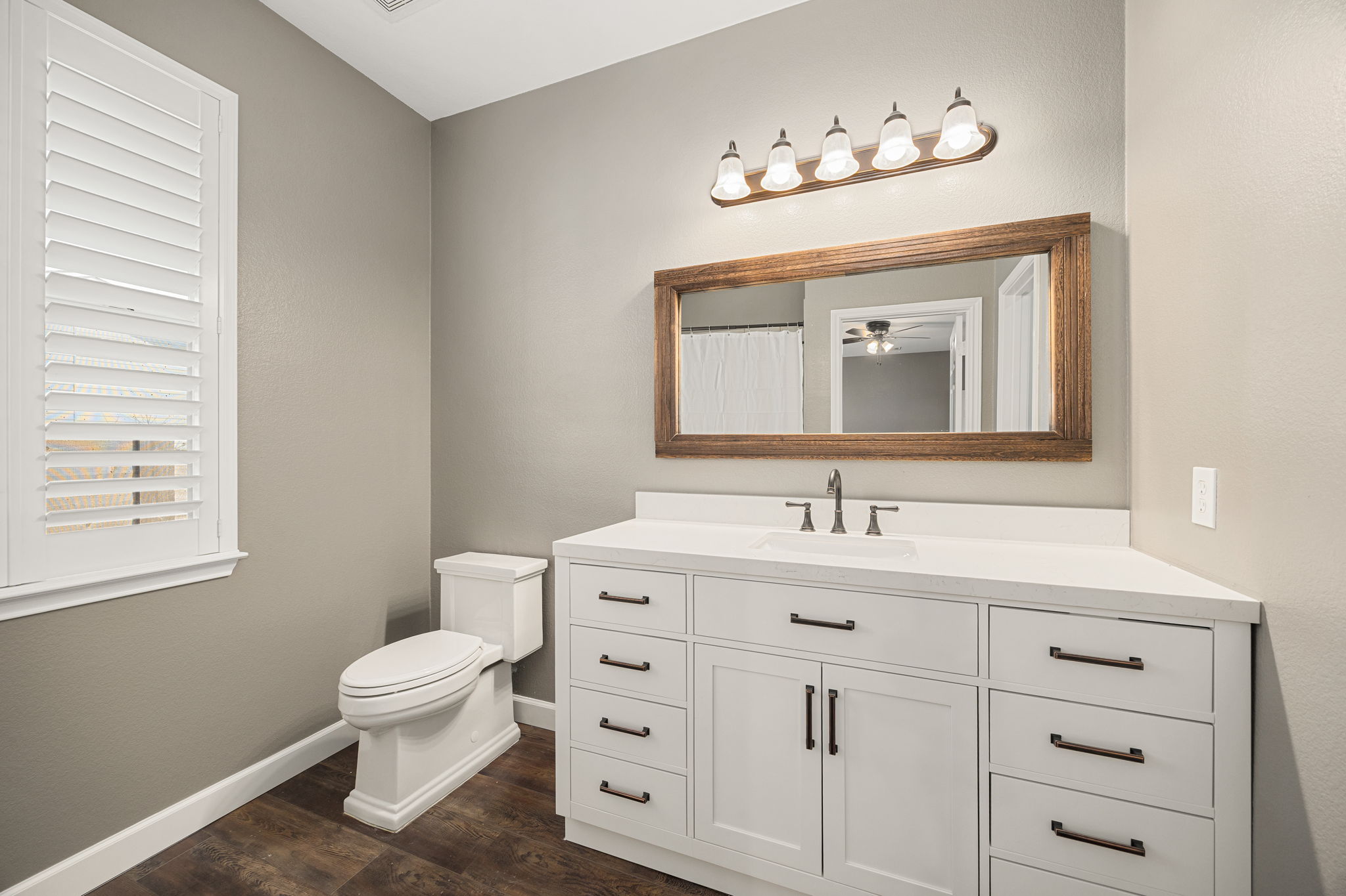 4805 Louis Avenue Austin, TX 78721 - Photo 10 of 23 a bathroom with a toilet sink and mirror