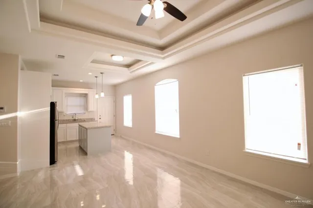 a view of a small space with wooden floor and a window