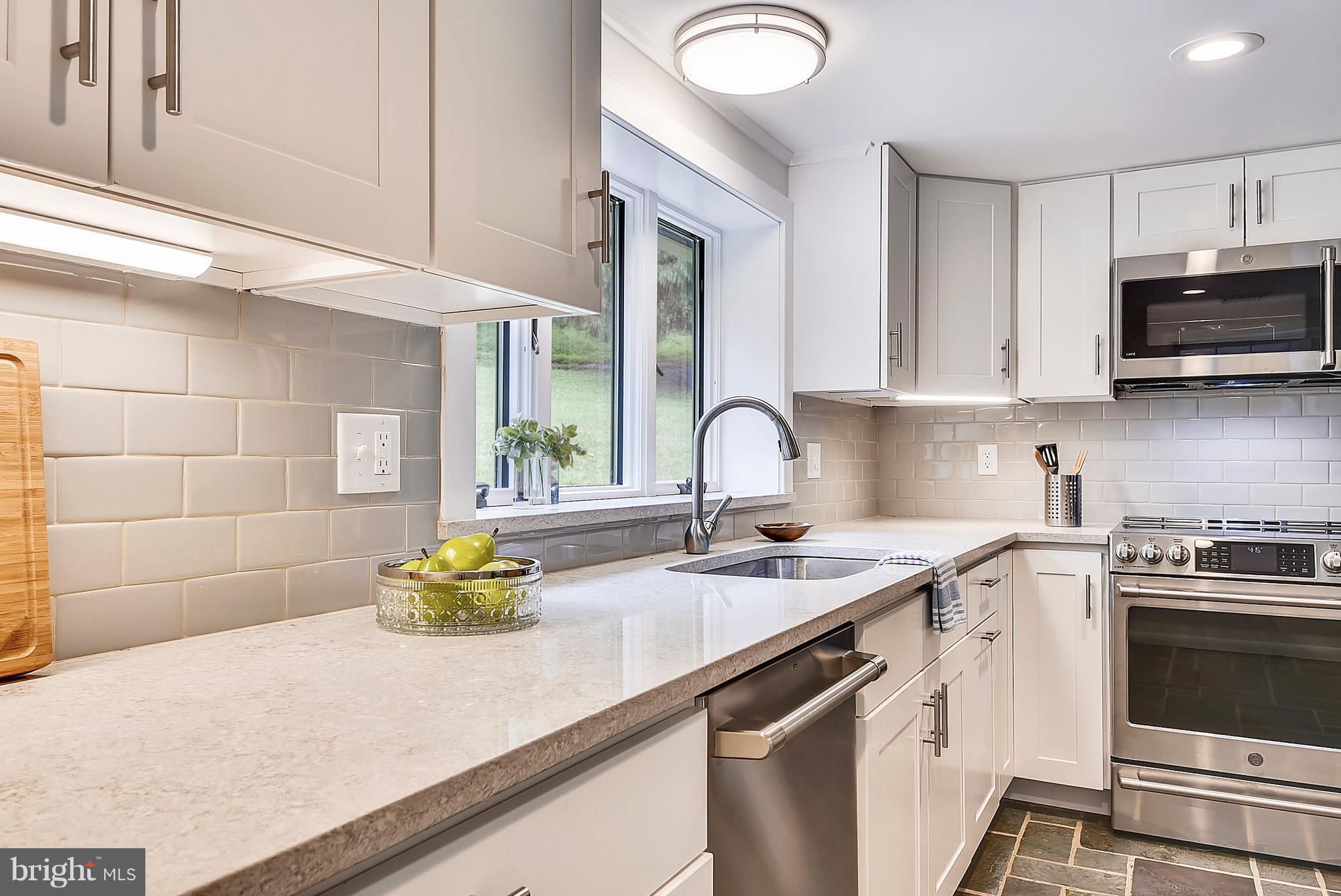 1625 Sparks Road Sparks, MD 21152 - Photo 10 of 30 a kitchen with stainless steel appliances granite countertop a sink a stove and a microwave