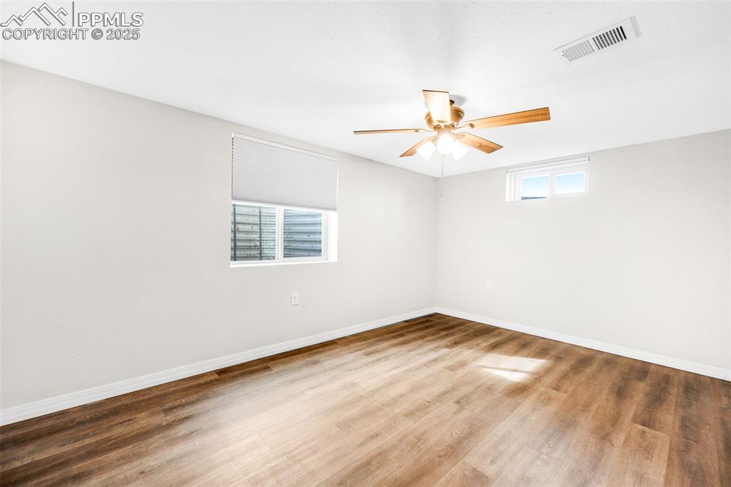 24 Drake Street Pueblo, CO 81005 - Photo 24 of 29 an empty room with a window and a ceiling fan