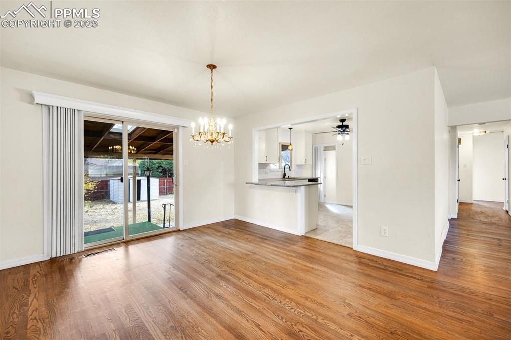24 Drake Street Pueblo, CO 81005 - Photo 7 of 29 a view of a kitchen with wooden floor and a kitchen