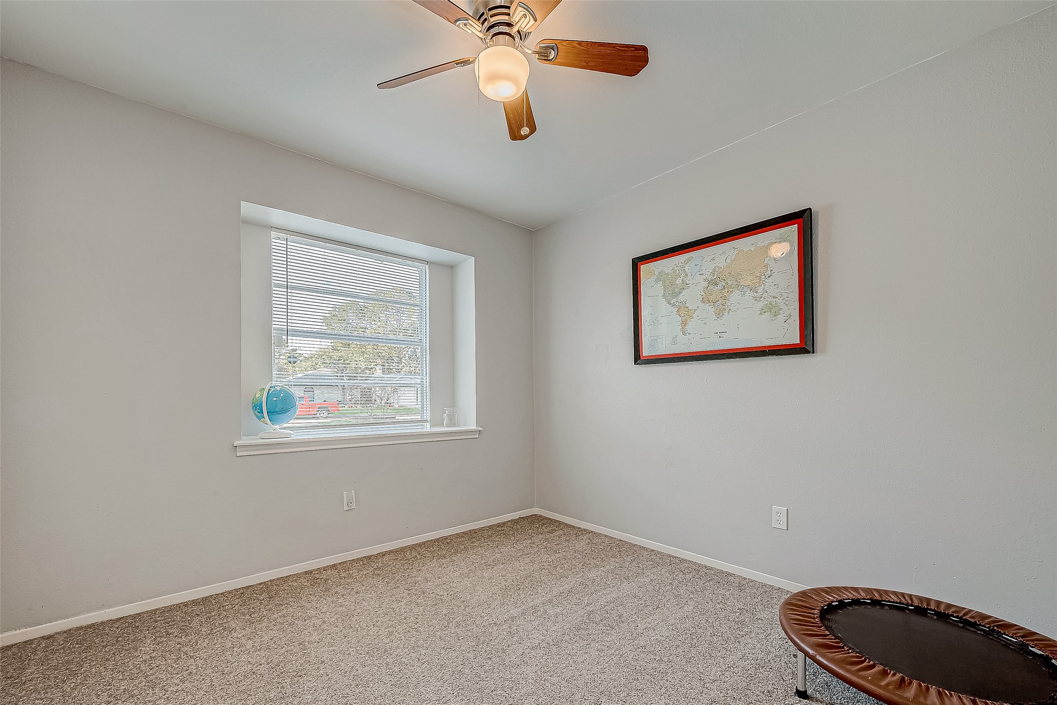 4731 Casemont Drive Spring, TX 77388 - Photo 24 of 50 a view of an empty room with window and a fan