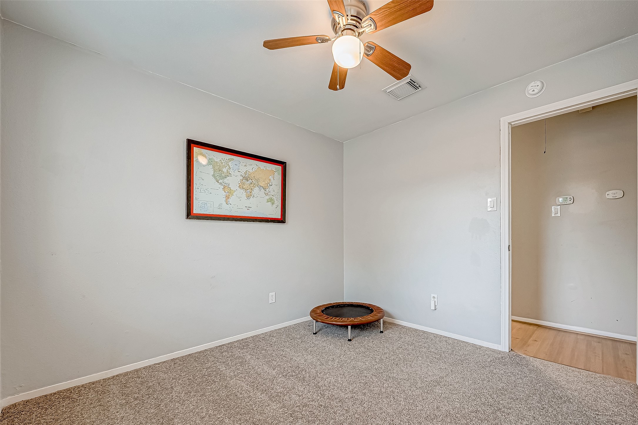 4731 Casemont Drive Spring, TX 77388 - Photo 25 of 50 an empty room with windows and ceiling fan