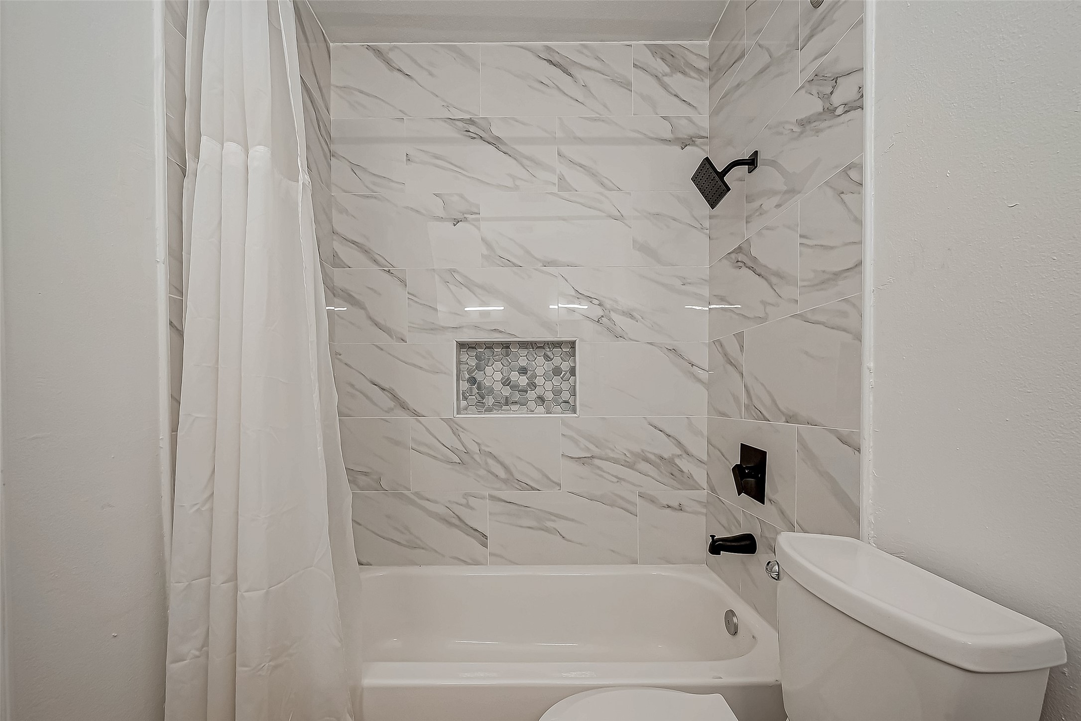 4731 Casemont Drive Spring, TX 77388 - Photo 28 of 50 a bathroom with a bathtub and a toilet