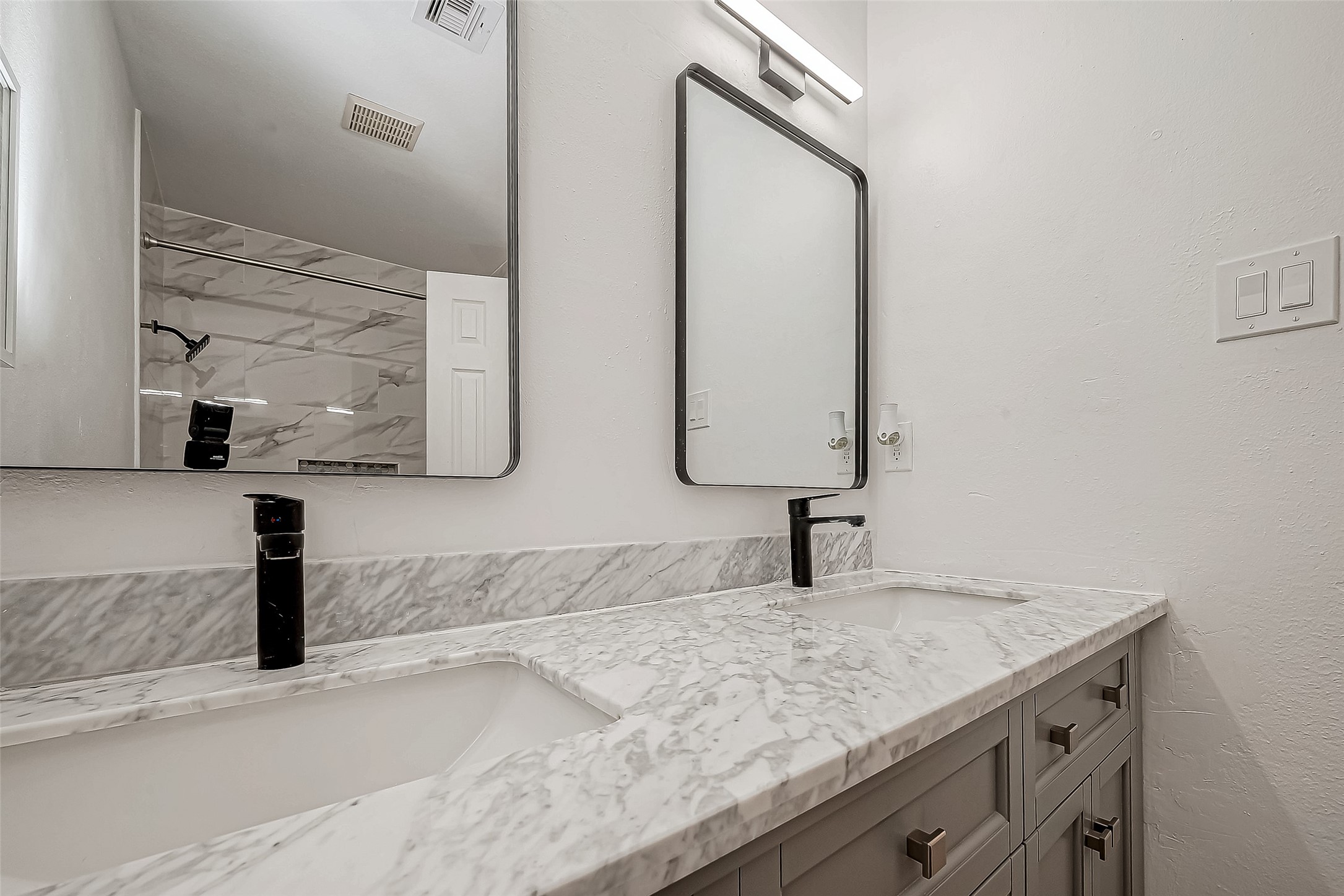 4731 Casemont Drive Spring, TX 77388 - Photo 29 of 50 a bathroom with a granite countertop sink and a mirror