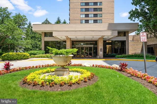 a view of a house with swimming pool and a garden