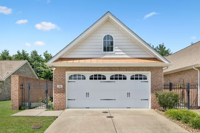 a front view of a house with a garage