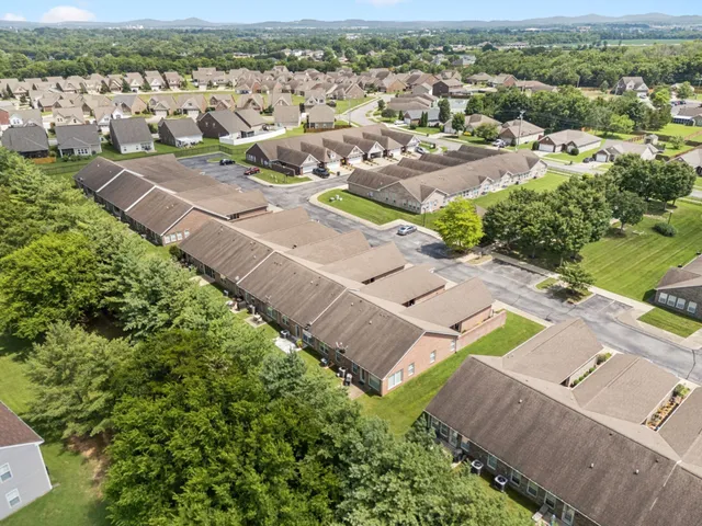 an aerial view of a house with a garden