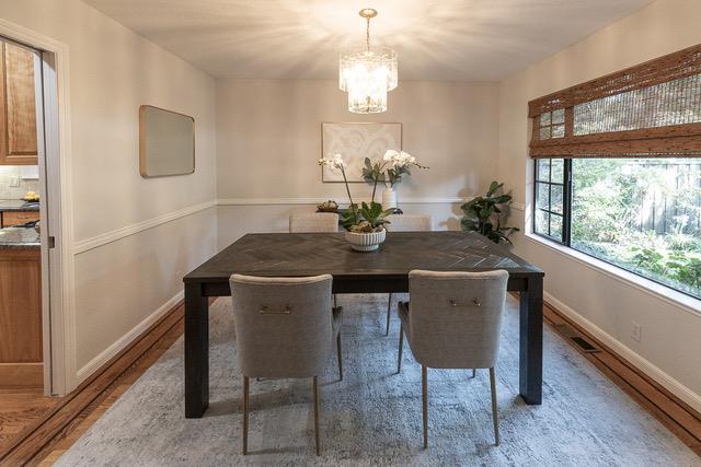 3523 Oak Drive Menlo Park, CA 94025 - Photo 11 of 20 a dining room with furniture a large window and wooden floor