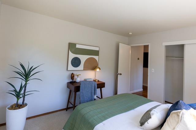 3523 Oak Drive Menlo Park, CA 94025 - Photo 14 of 20 a bedroom with a bed and a potted plant