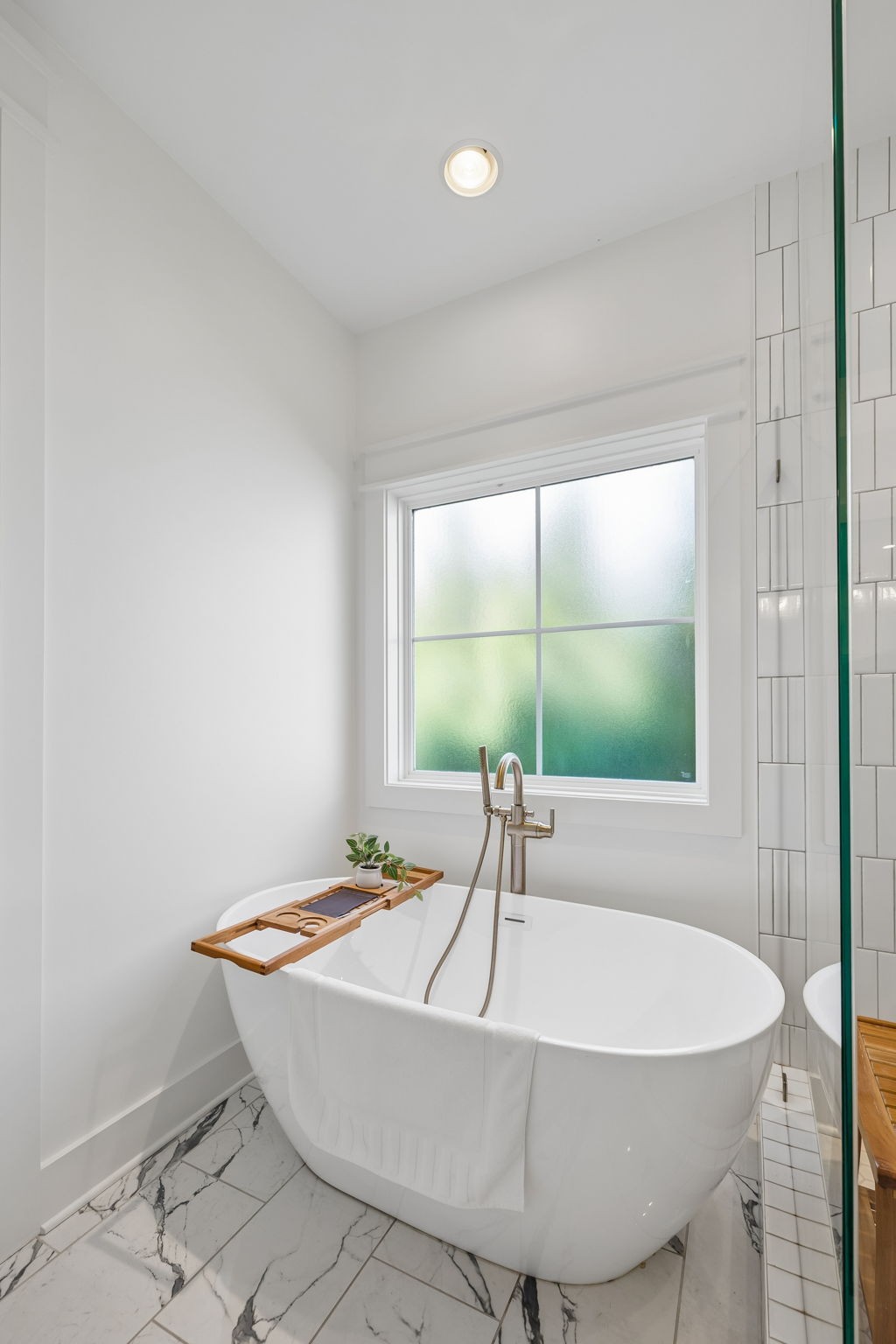 154 Barefoot Way Winchester, TN 37398 - Photo 46 of 98 a white bath tub sitting in a bathroom next to a window