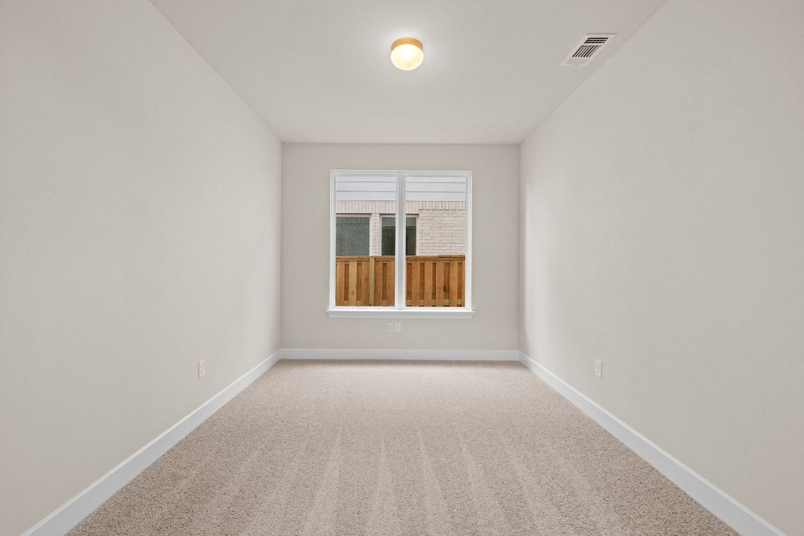 621 Buckaroo Drive Georgetown, TX 78633 - Photo 12 of 30 a view of an empty room with a window