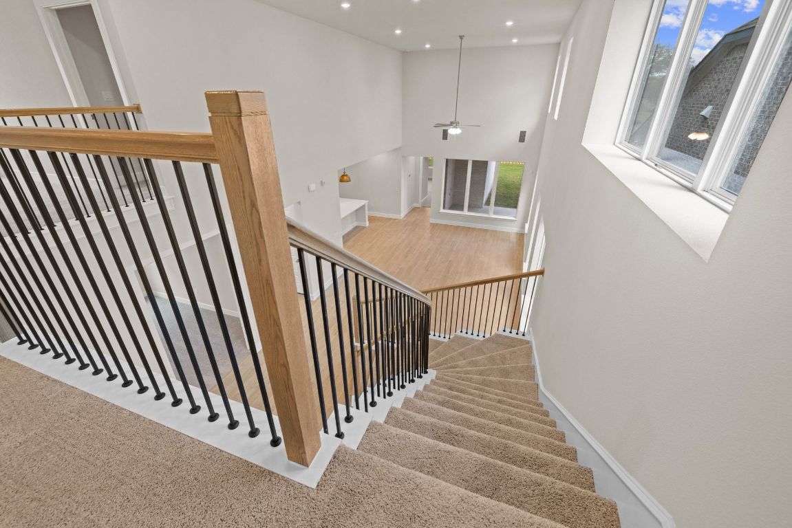 621 Buckaroo Drive Georgetown, TX 78633 - Photo 22 of 30 a view of a hallway with wooden floor and staircase