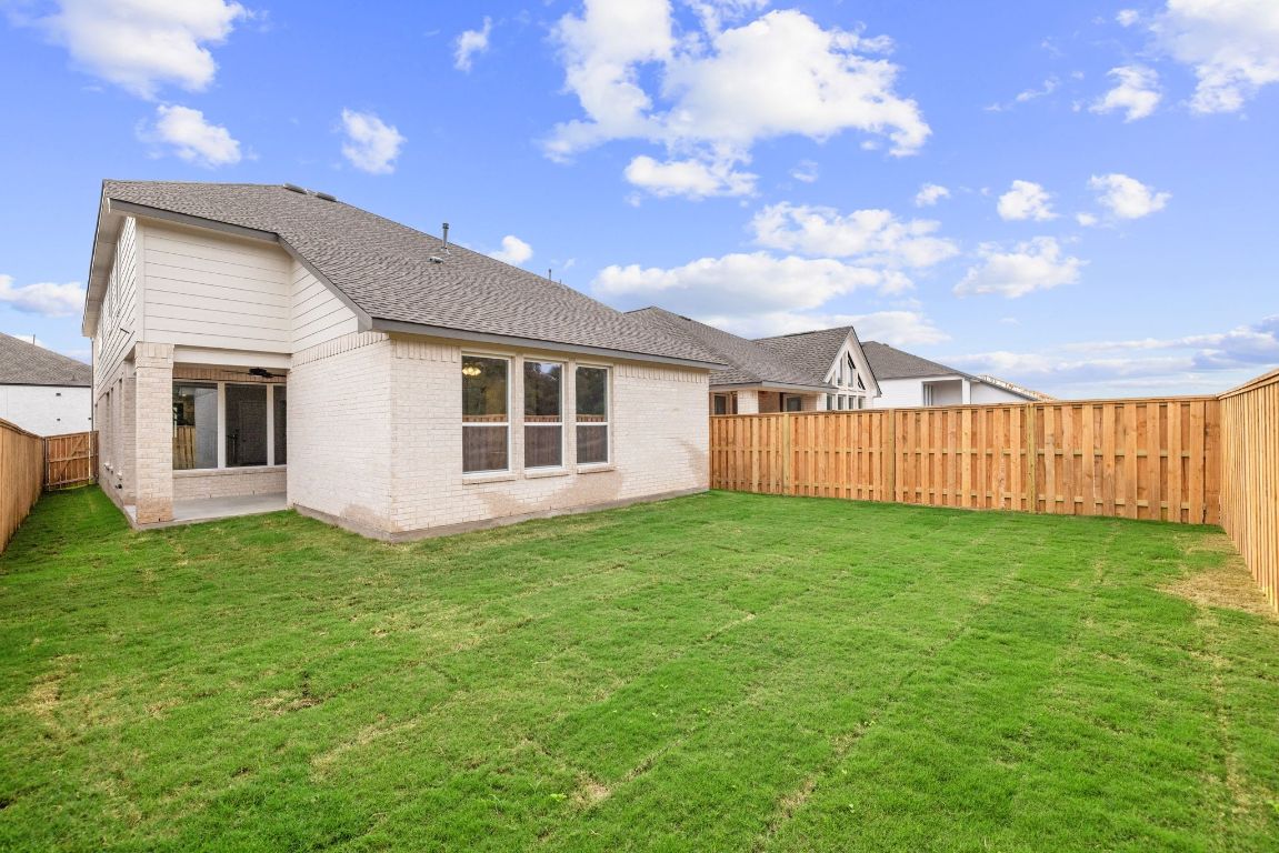 621 Buckaroo Drive Georgetown, TX 78633 - Photo 25 of 30 a view of a backyard with a garden