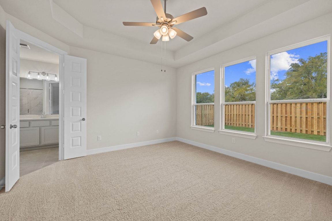 621 Buckaroo Drive Georgetown, TX 78633 - Photo 9 of 30 wooden floor in an empty room with a window