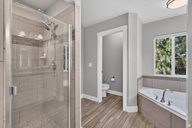 1263 East 1200th South Springville, UT 84663 - Photo 22 of 60 Expansive walk-in shower with a glass enclosure, dual shower heads, and an integrated tile bench