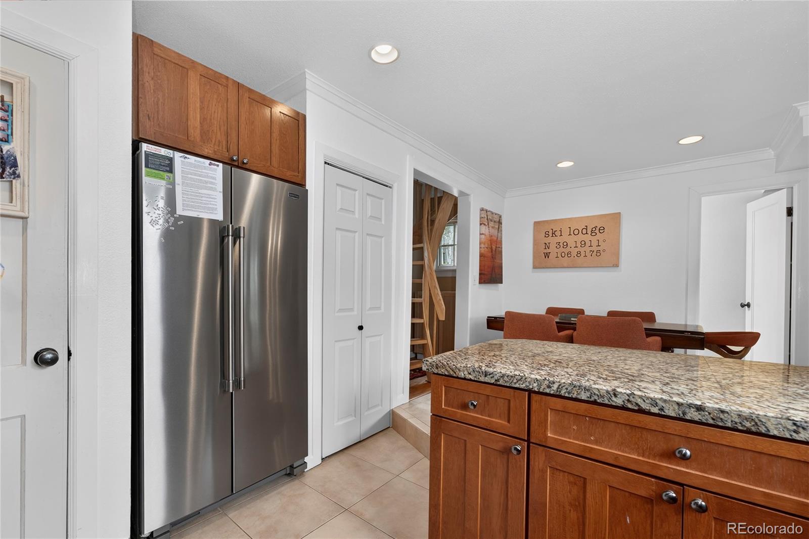 327 Vasquez Road, Unit E1 Winter Park, CO 80482 - Photo 34 of 43 a kitchen with granite countertop stainless steel appliances granite countertop a refrigerator and a sink