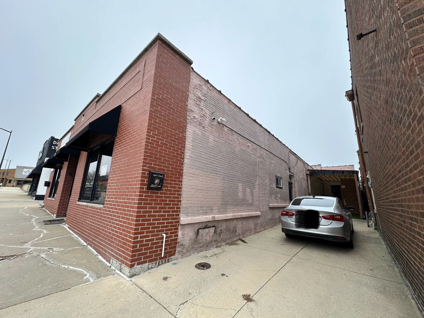 229 West Galena Boulevard Aurora, IL 60506 - Photo 3 of 3 a car parked in front of a building
