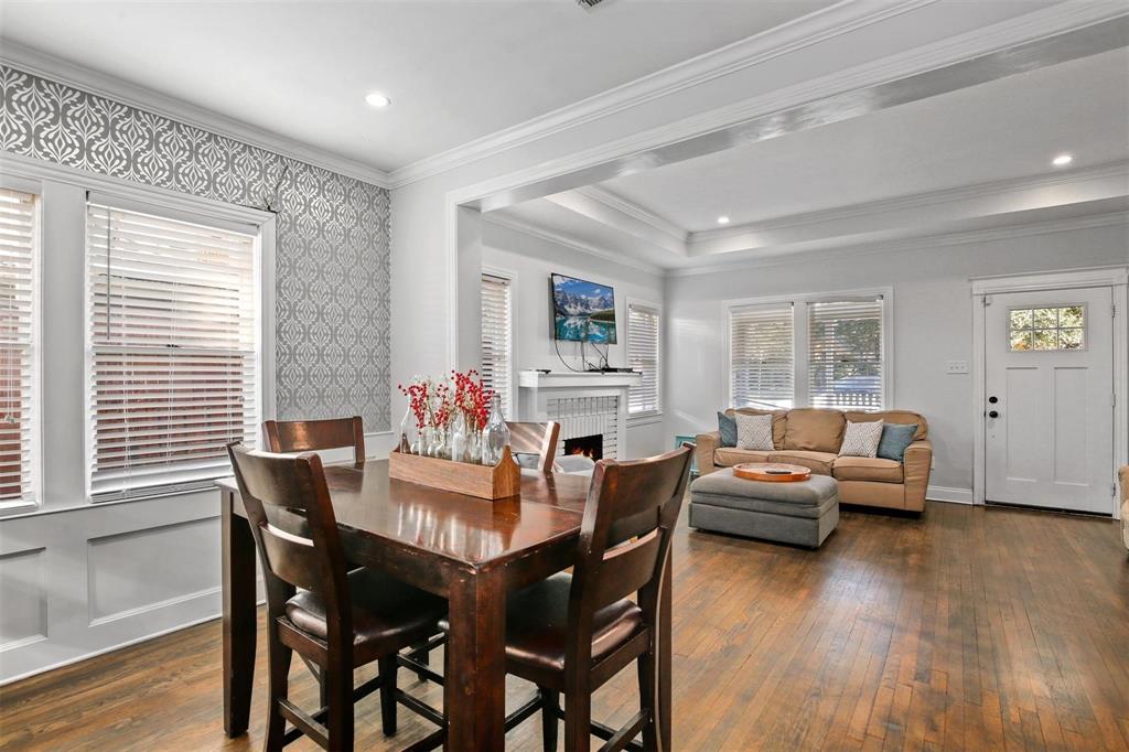 5227 Homer Street Dallas, TX 75206 - Photo 11 of 36 a view of a dining room with furniture and wooden floor