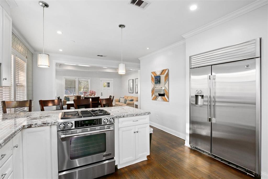 5227 Homer Street Dallas, TX 75206 - Photo 15 of 36 a kitchen with a stove oven and a refrigerator