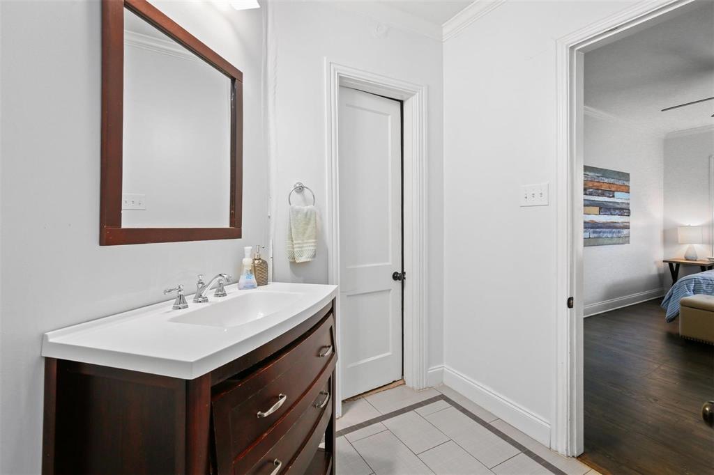5227 Homer Street Dallas, TX 75206 - Photo 19 of 36 a bathroom with a sink and a mirror