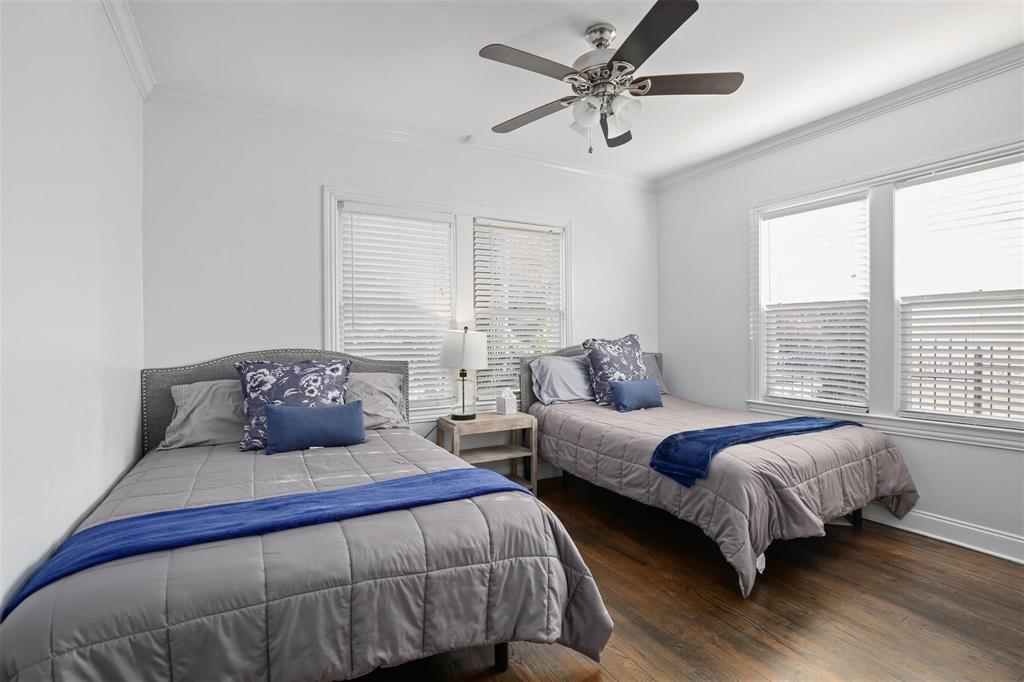 5227 Homer Street Dallas, TX 75206 - Photo 20 of 36 a bedroom with two beds and a large window