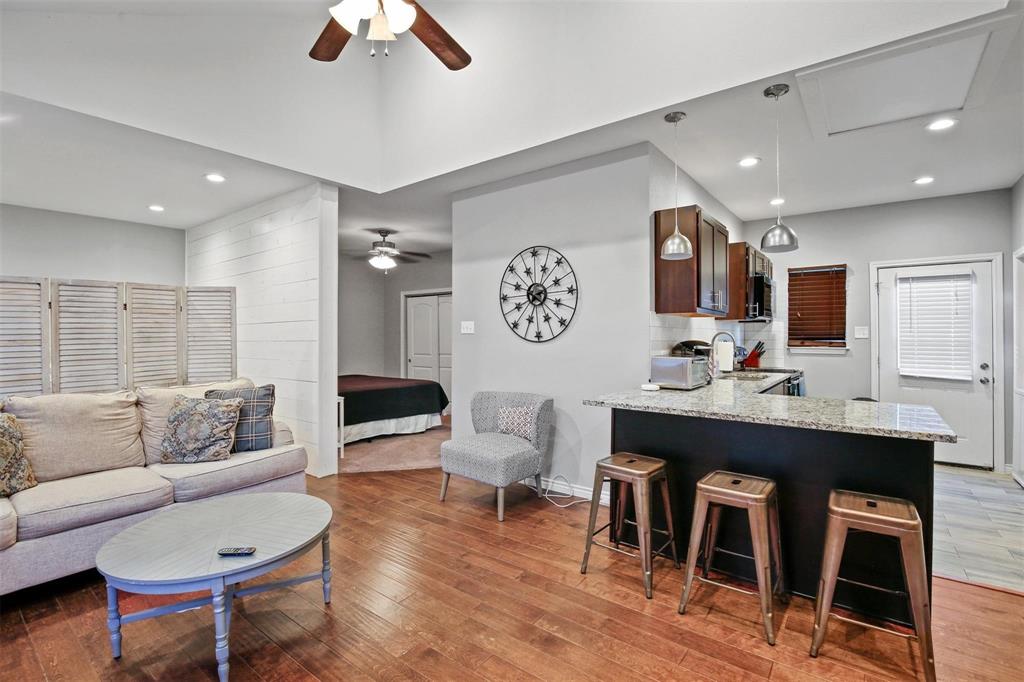 5227 Homer Street Dallas, TX 75206 - Photo 30 of 36 a living room with furniture and kitchen view