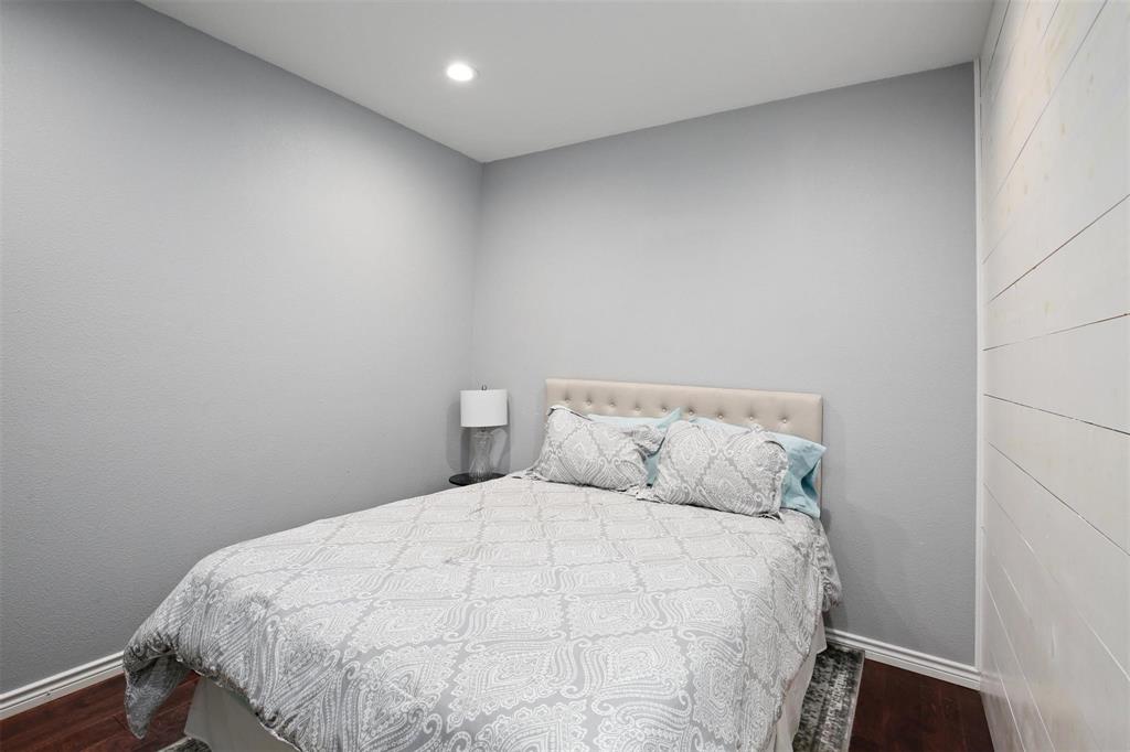 5227 Homer Street Dallas, TX 75206 - Photo 33 of 36 a large bed sitting in a bedroom next to a window