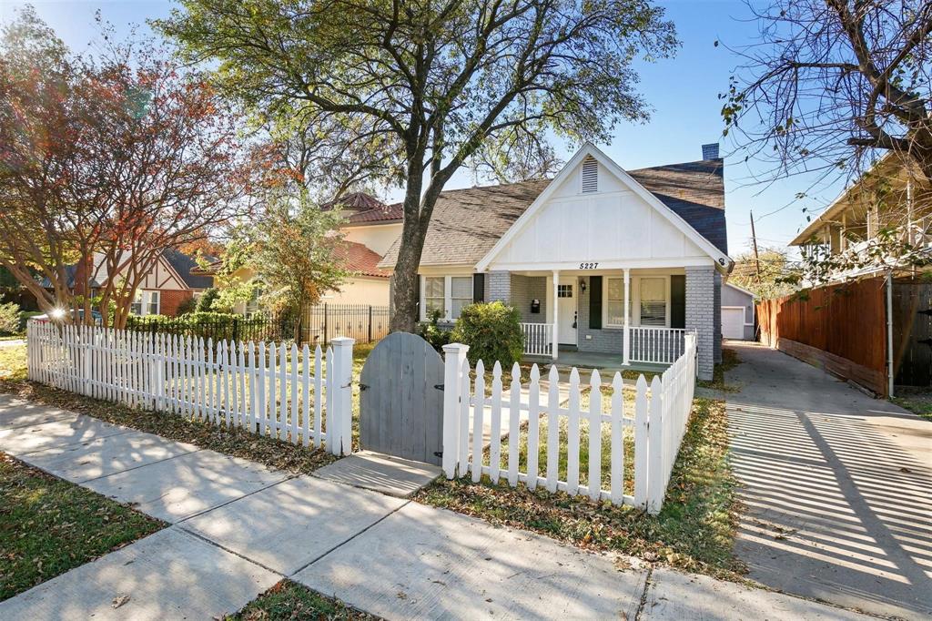 5227 Homer Street Dallas, TX 75206 - Photo 5 of 36 a front view of a house with a glass door