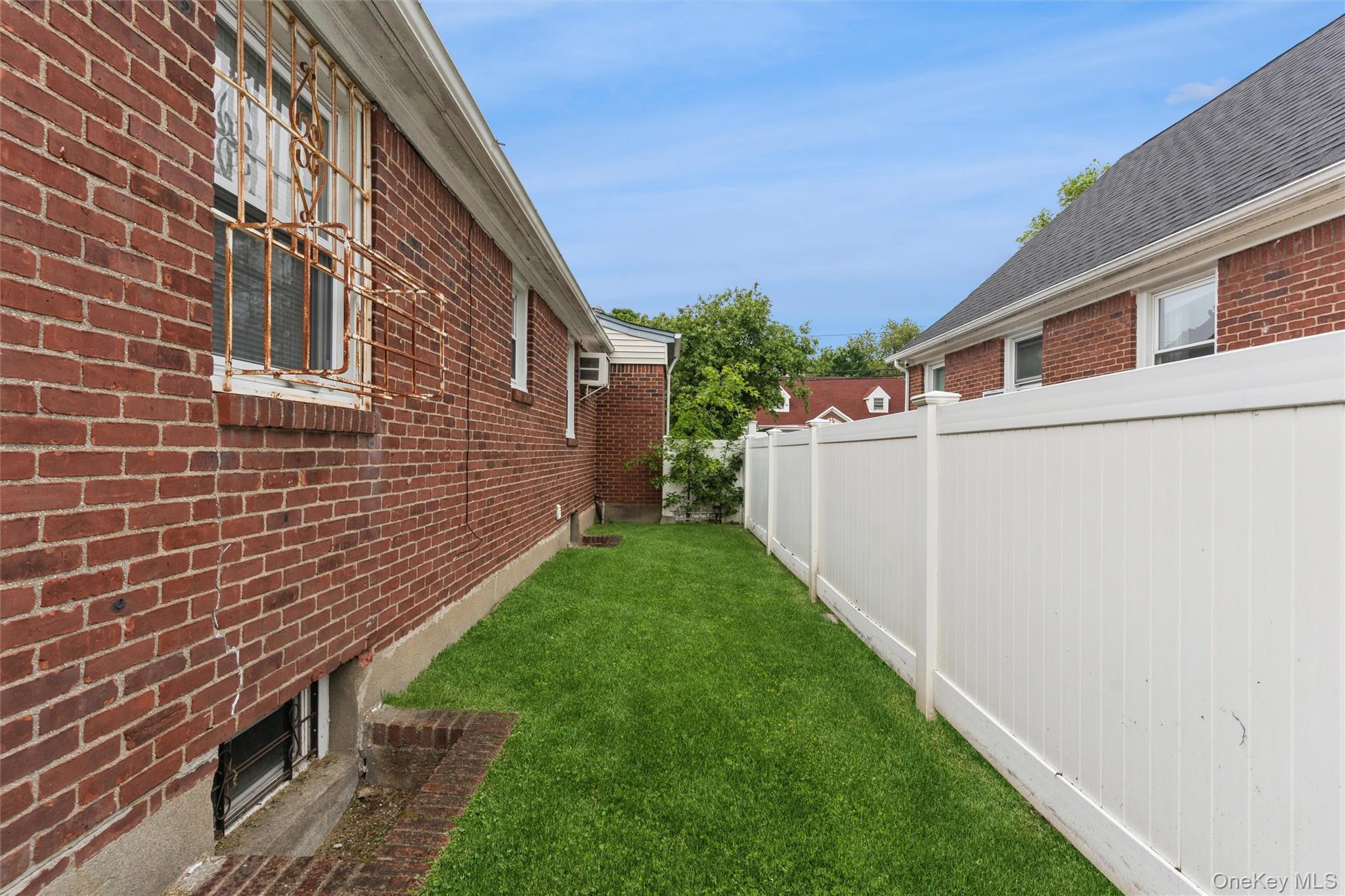 6 Jasper Street Valley Stream, NY 11580 - Photo 18 of 19 a backyard of a house with lots of green space