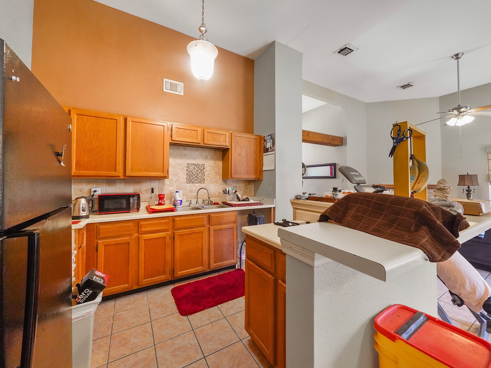 18527 Trail Bend Lane Houston, TX 77084 - Photo 5 of 18 Tiled backsplash and several cabinet storage options.