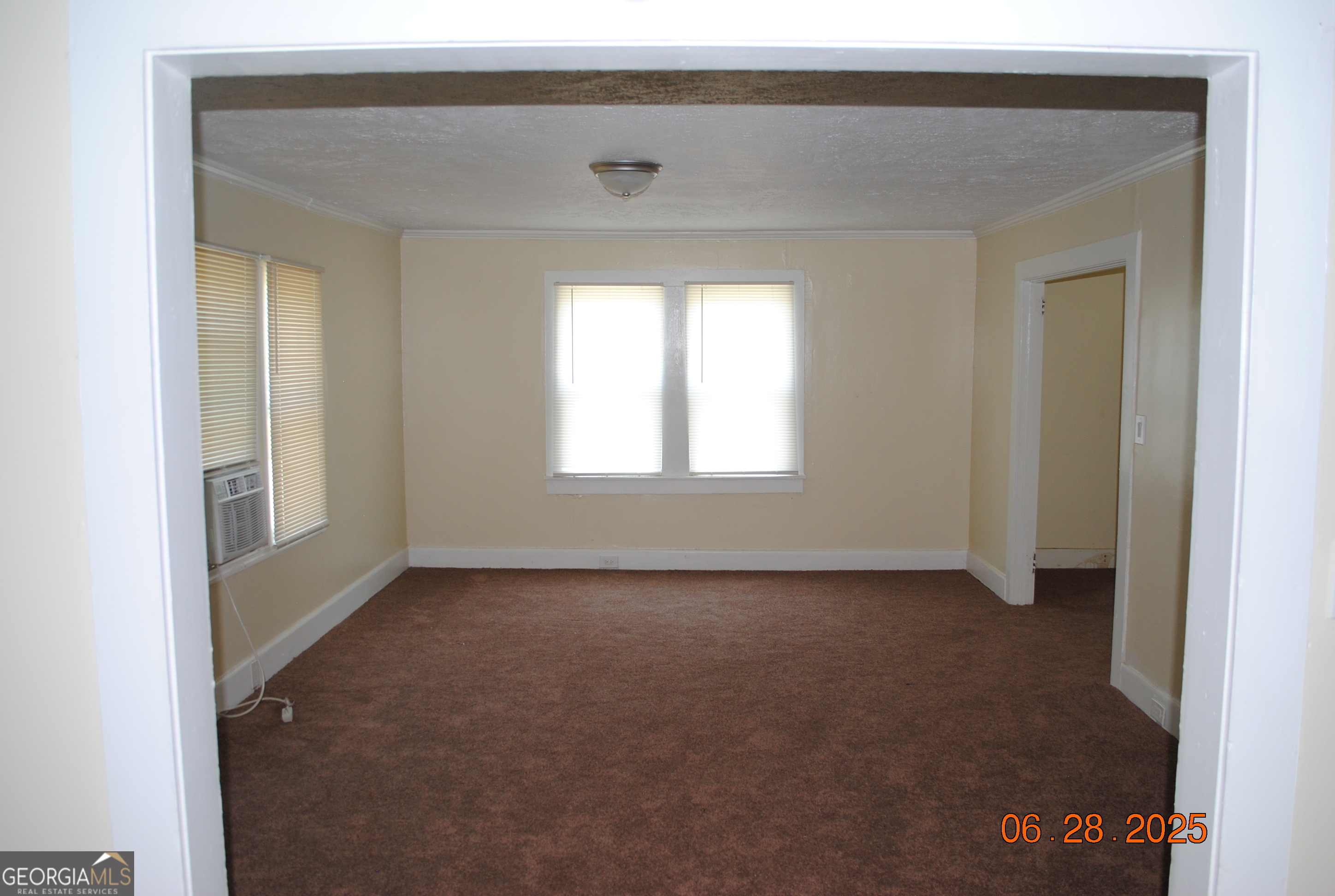 532 Calhoun Street Swainsboro, GA 30401 - Photo 6 of 10 a view of an empty room with a window