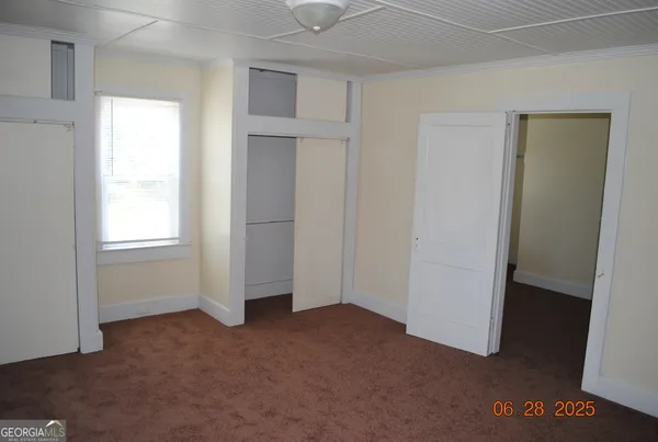 a view of empty room with windows