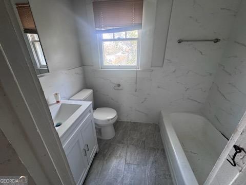 532 Calhoun Street Swainsboro, GA 30401 - Photo 10 of 10 a white toilet sitting next to a bath tub