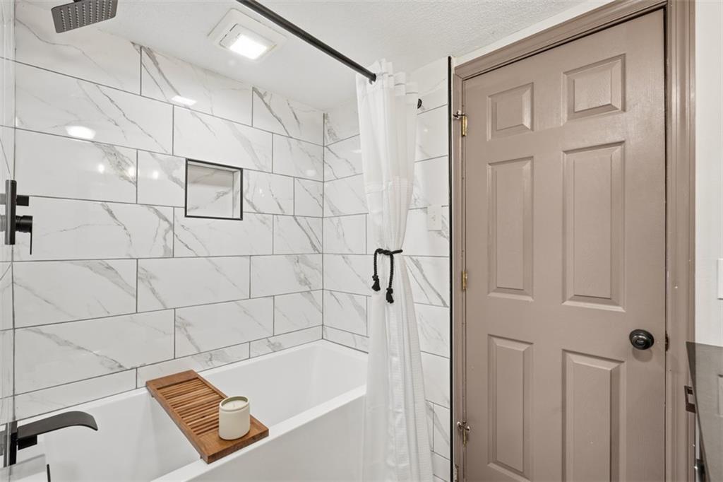8517 Wittmer Road Pittsburgh, PA 15237 - Photo 34 of 46 a bathroom with a tub and shower
