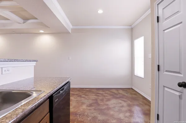 a view of a kitchen that shows a sink stainless steel appliances wooden floor and a kitchen