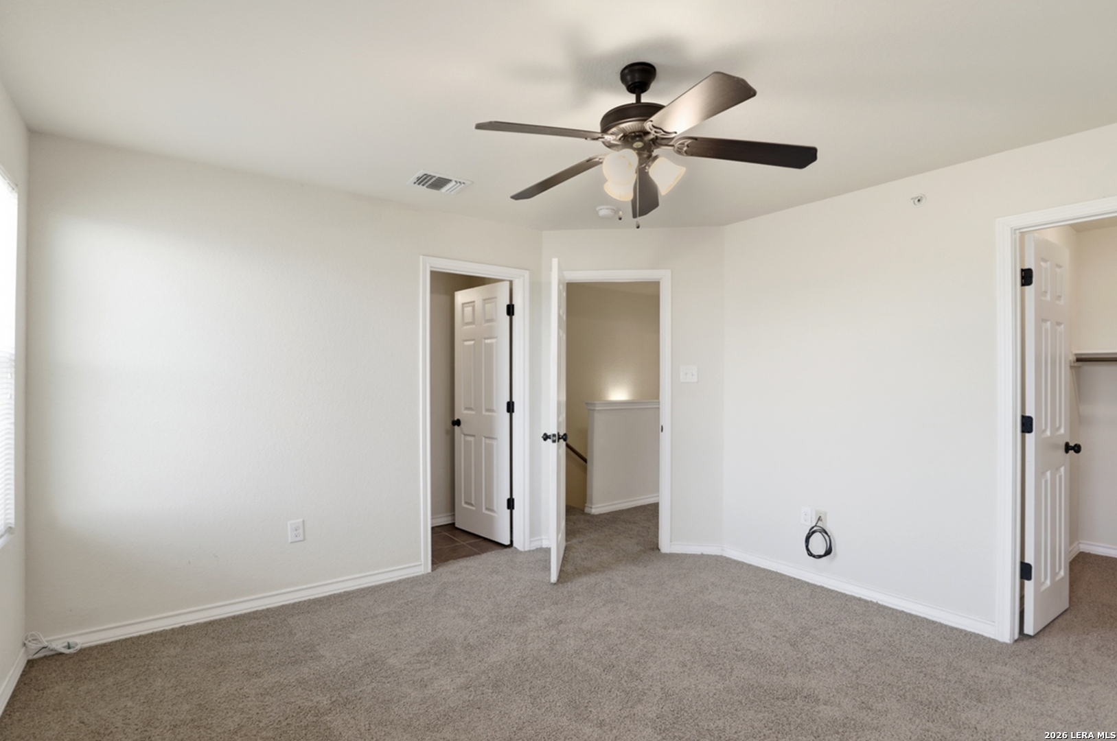 16821 Showdown Path, Unit 3 Schertz, TX 78154 - Photo 15 of 25 a view of a room with a ceiling fan and a fan