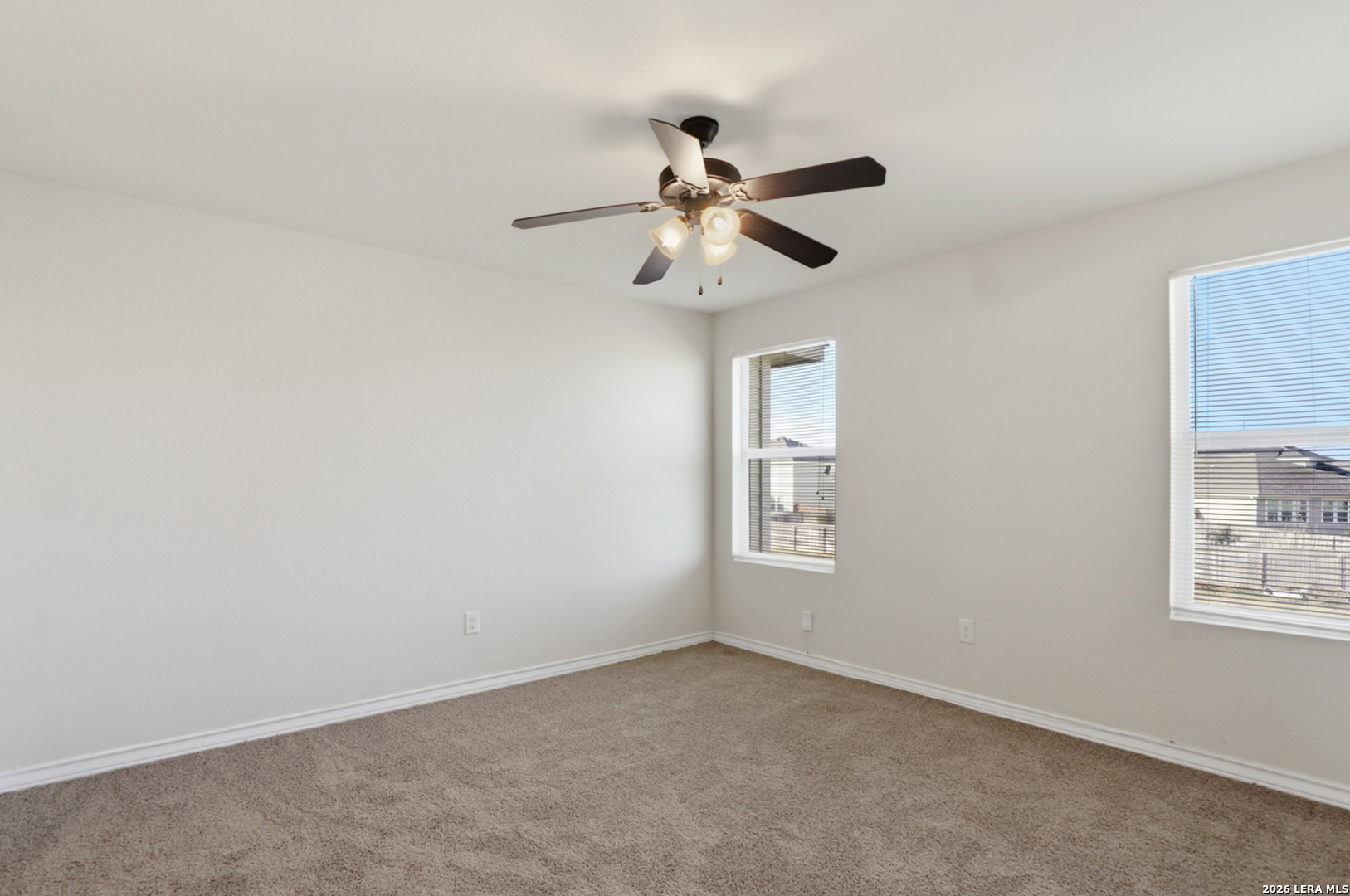 16821 Showdown Path, Unit 3 Schertz, TX 78154 - Photo 16 of 25 a view of an empty room with a window