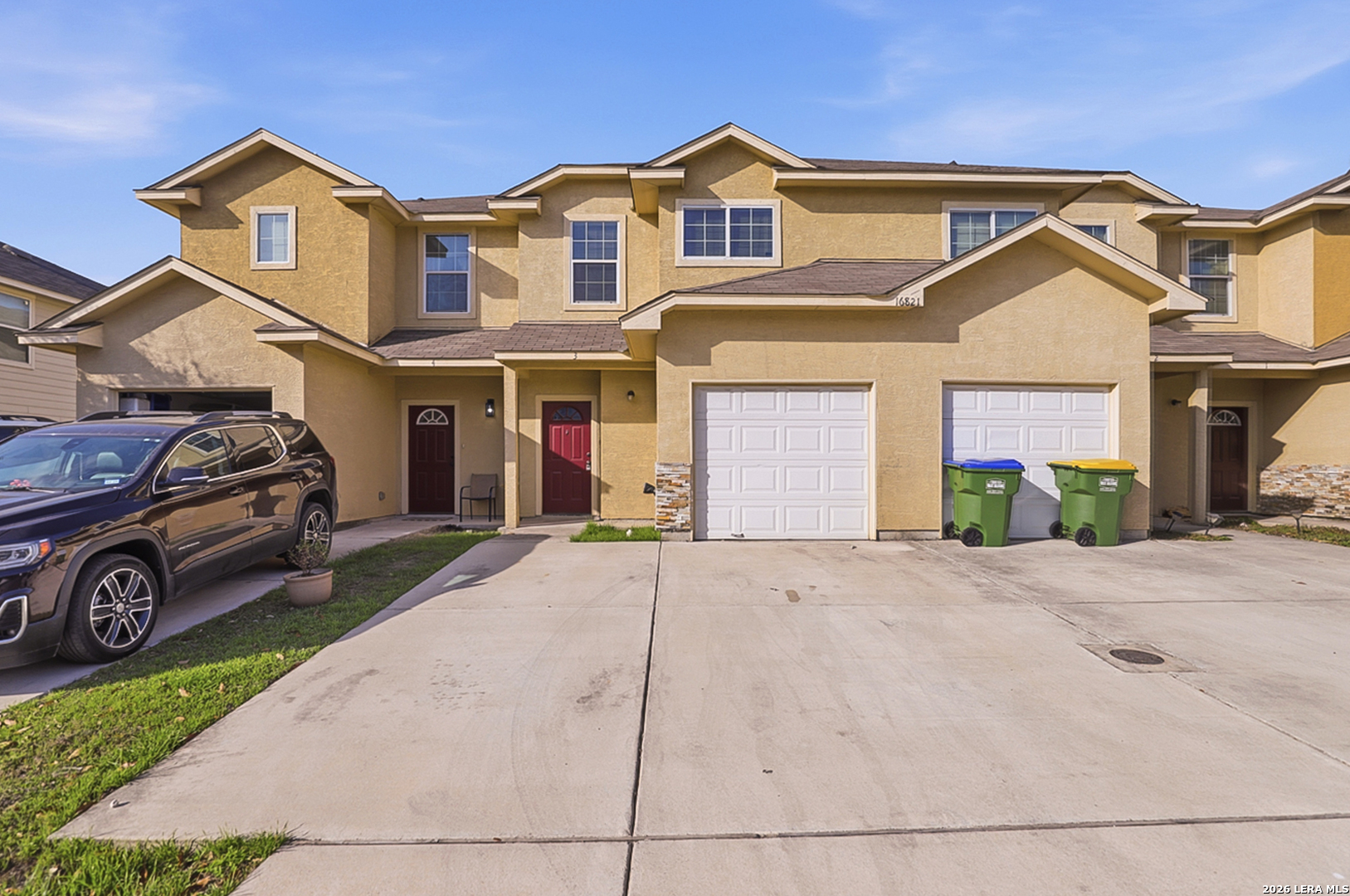 16821 Showdown Path, Unit 3 Schertz, TX 78154 - Photo 2 of 25 a front view of a house with a yard and garage