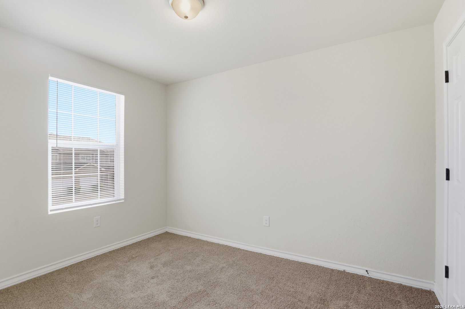 16821 Showdown Path, Unit 3 Schertz, TX 78154 - Photo 21 of 25 an empty room with windows