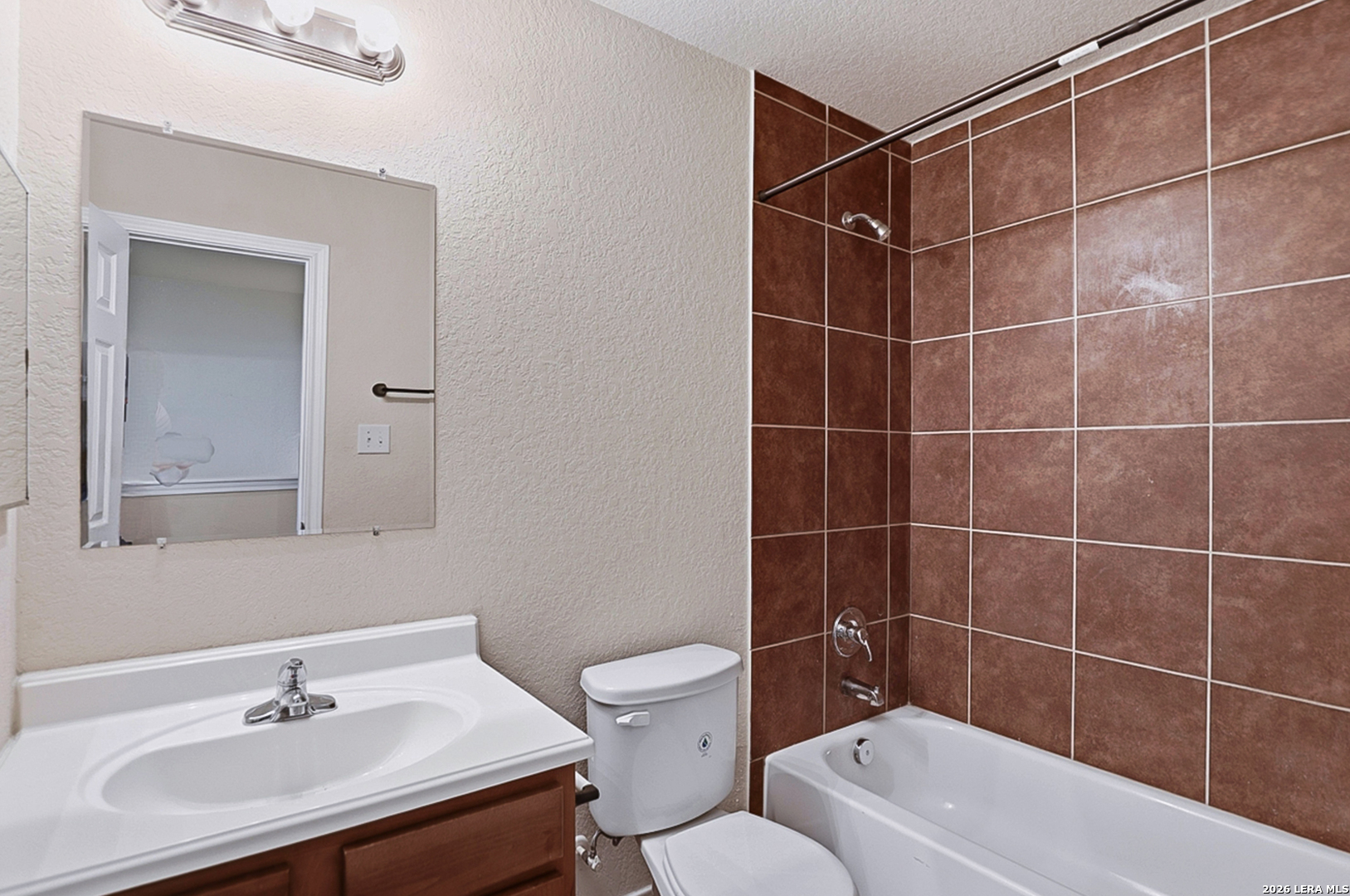 16821 Showdown Path, Unit 3 Schertz, TX 78154 - Photo 22 of 25 a bathroom with a sink toilet and shower