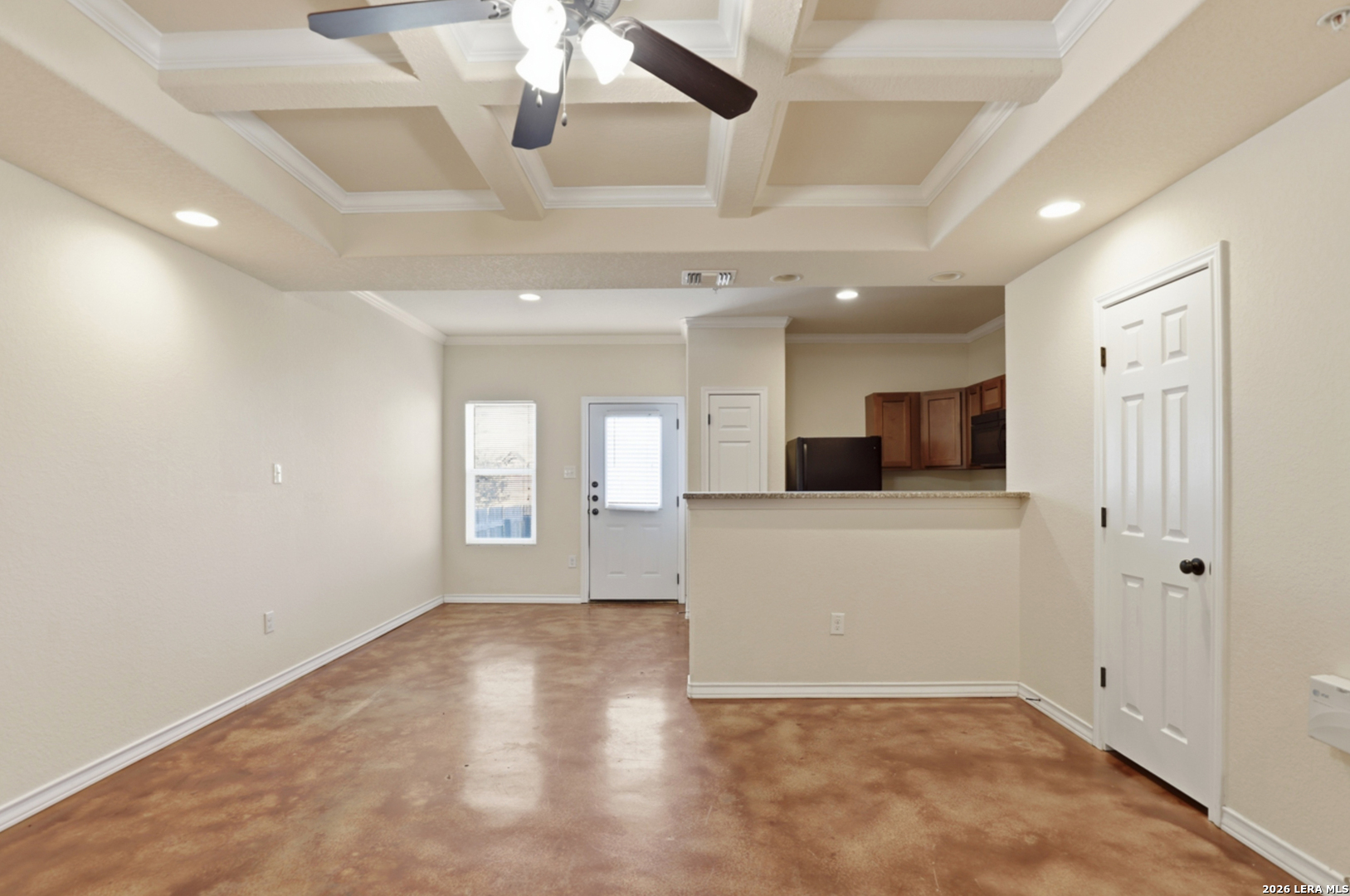 16821 Showdown Path, Unit 3 Schertz, TX 78154 - Photo 7 of 25 a view of an empty room with kitchen and a window