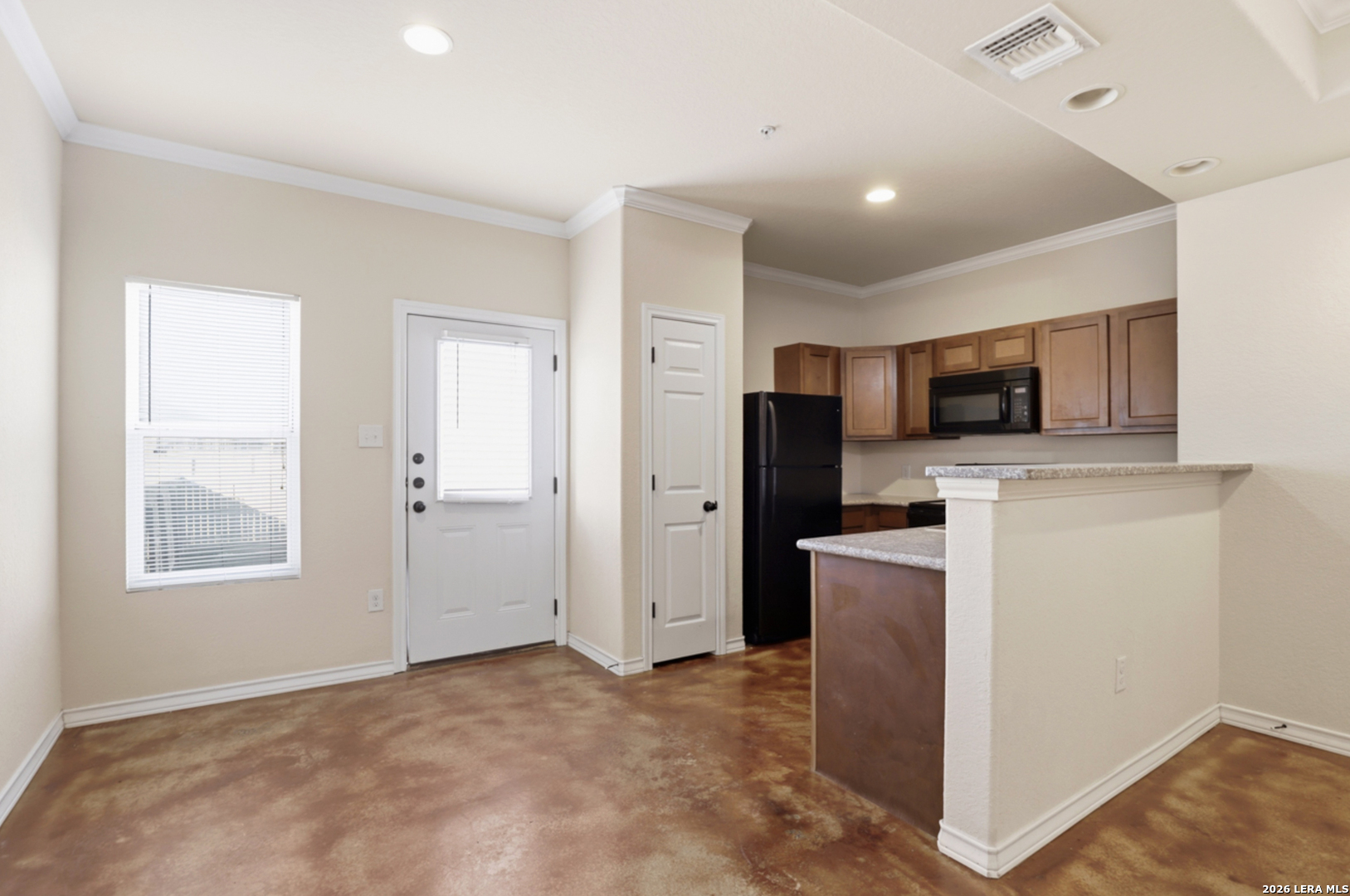 16821 Showdown Path, Unit 3 Schertz, TX 78154 - Photo 10 of 25 a view of a kitchen with a sink stove and cabinet