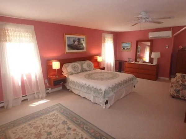 a bedroom with a bed and a couch