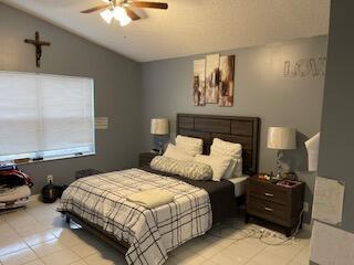 10251 Breezeway Place Boca Raton, FL 33428 - Photo 11 of 20 a bedroom with a bed and window