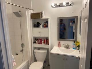 10251 Breezeway Place Boca Raton, FL 33428 - Photo 17 of 20 a bathroom with a toilet sink and shower