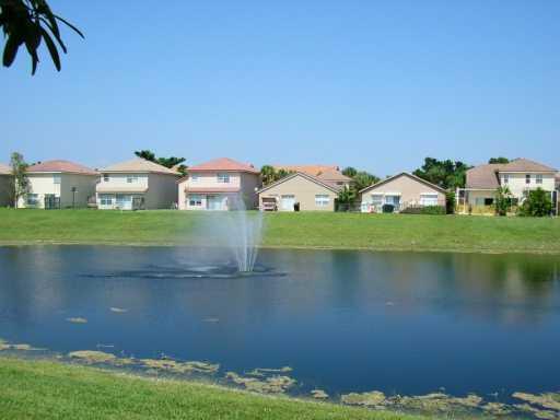 10251 Breezeway Place Boca Raton, FL 33428 - Photo 4 of 20 a view of a lake with houses