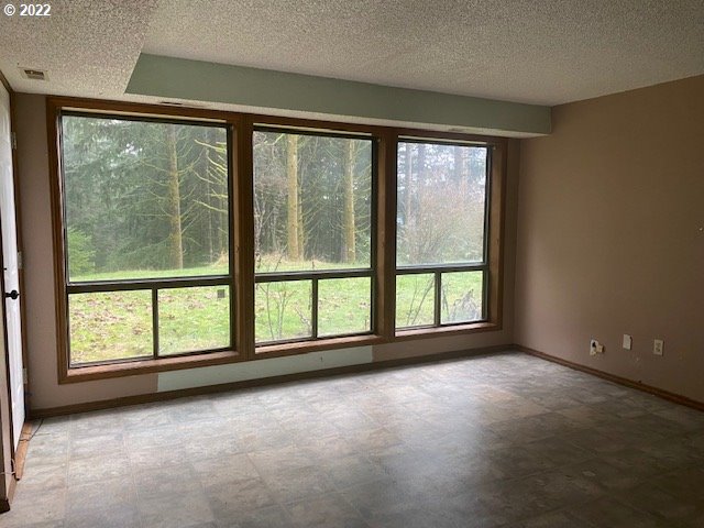 7705 Northeast Quarry Road La Center, WA 98629 - Photo 20 of 27 a view of room with window and floor to ceiling window